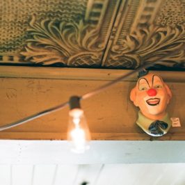 Clown figurine hanging on a wall