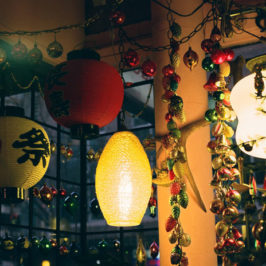 Lanterns and Christmas ornaments in a window